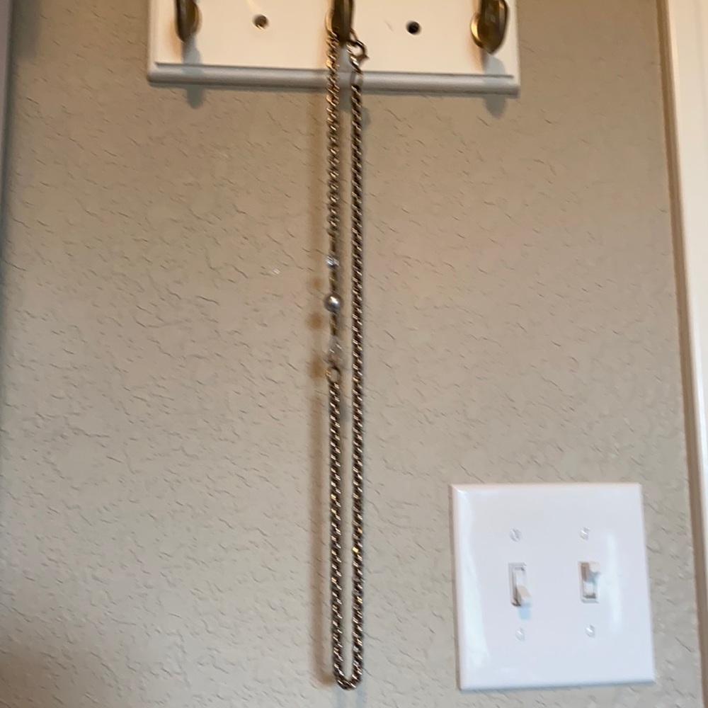 Long silver necklace with clear bead design